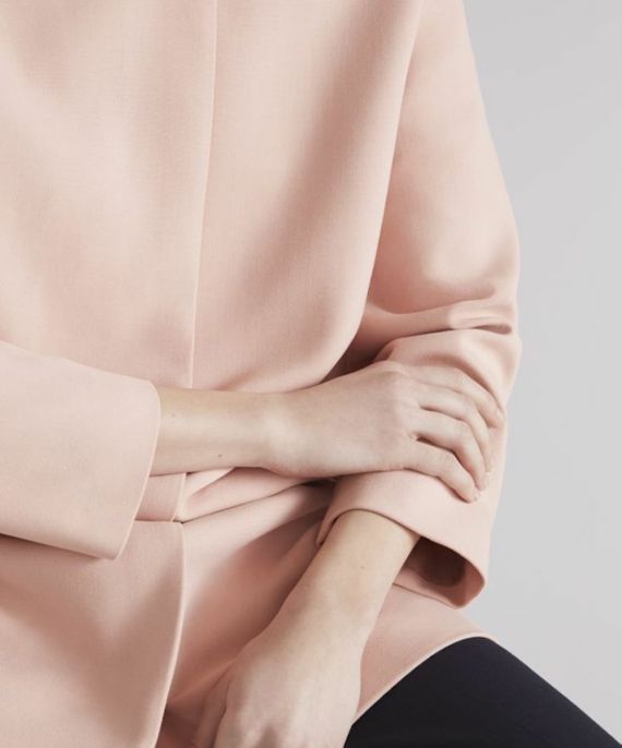 Color concept pastel dusky pink jacket female hands design