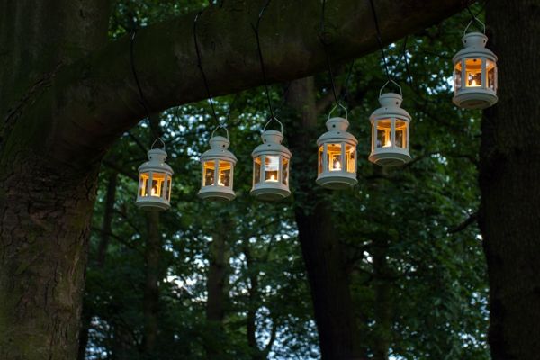 Lanterns spread a warm light behind glass