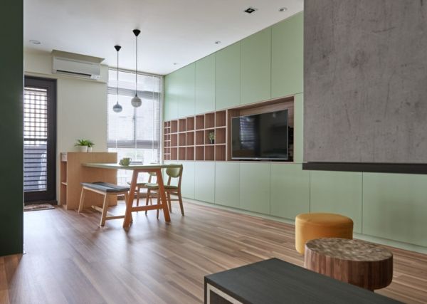 Living area interior design dining area green furniture wooden floor