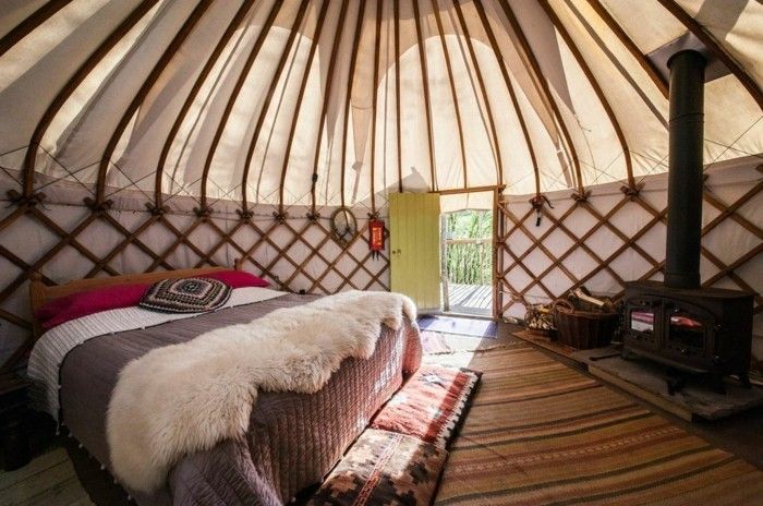 Glamping as a modern family vacation canopy bed