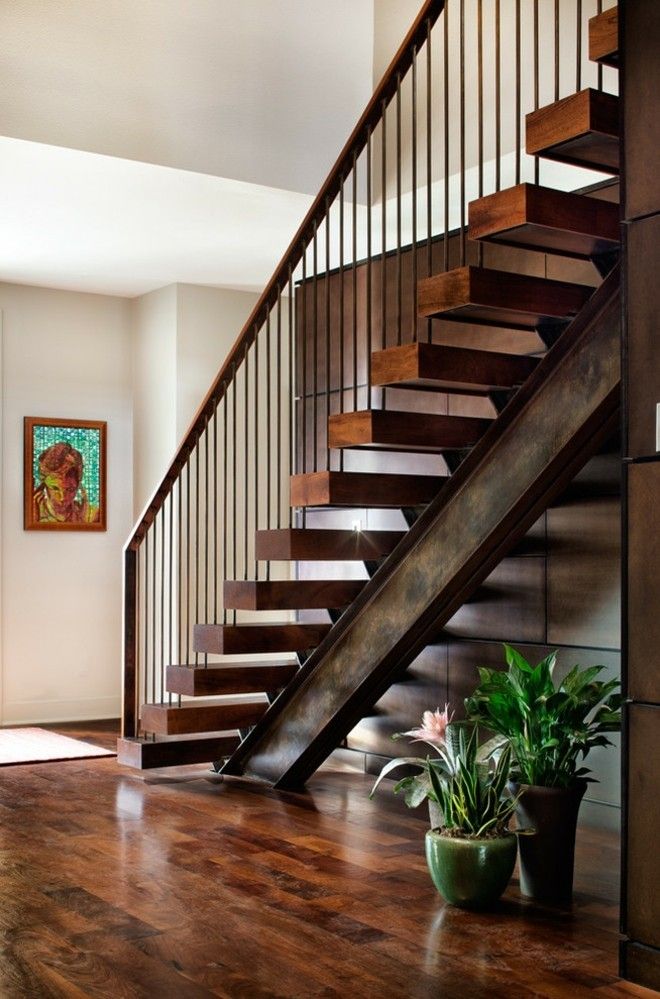 Wooden spiral staircase with metal railing