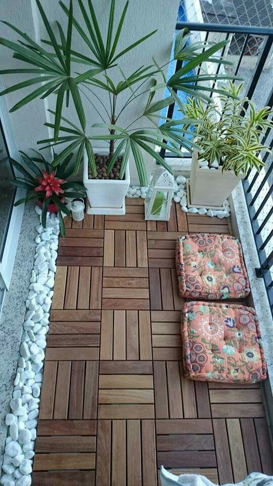geometric wooden floor white stones on the balcony floor pillows