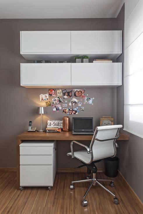 Cabinets above the desk in the home office white furniture