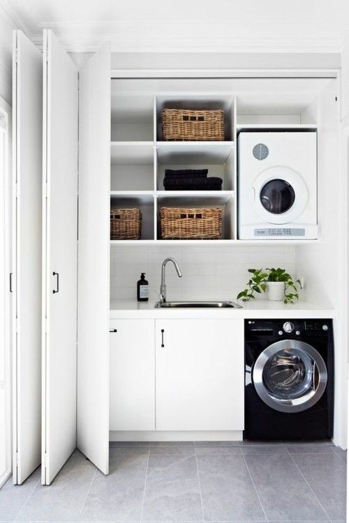Laundry room black washing machine accordion door
