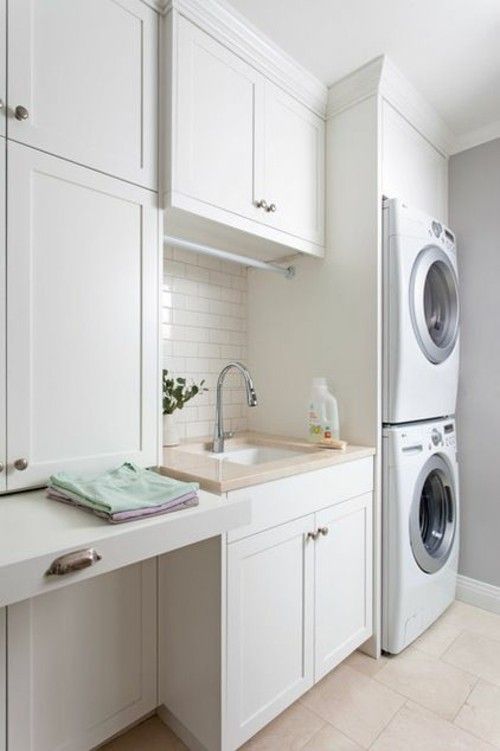 Laundry room vertical positioning of equipment
