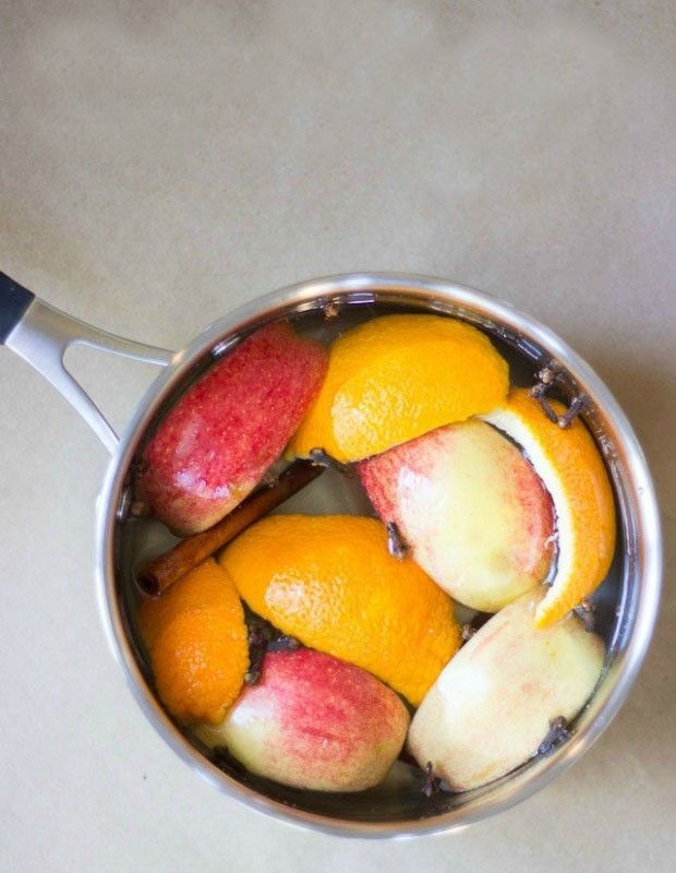 Cooking pot-full-fruit-apple-slices-tangerine-orange-lemon-cinnamon stick