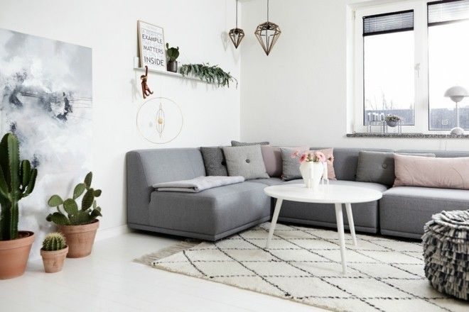 gray-corner-sofa-many-seats-carpet-ottoman