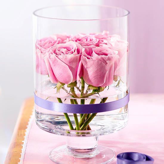 Glass vase of rose petals