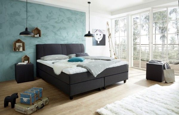 Moderne Schlafzimmereinrichtung bequemes Boxspringbett blau grau weiß