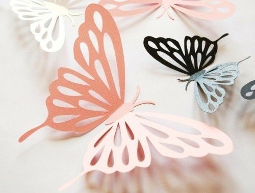 Schmetterlinge aus Papier basteln und als Tischdeko verwenden 