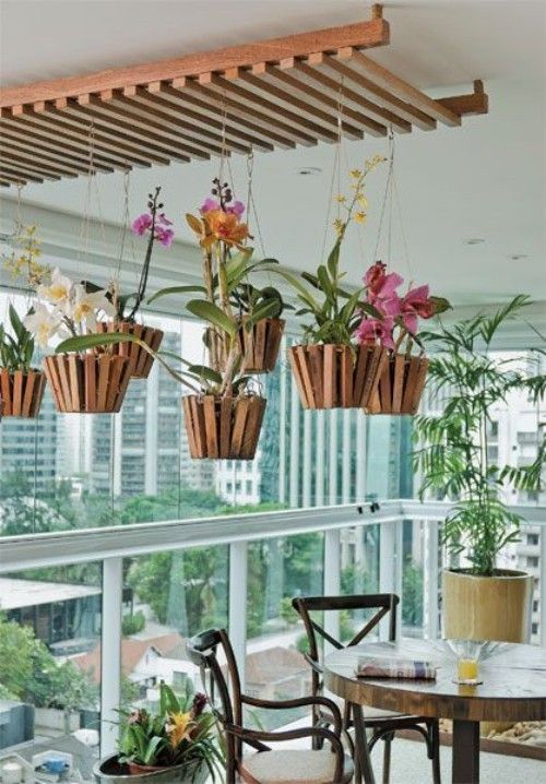 The hanging baskets with these beautiful flowers are great highlights on this balcony.