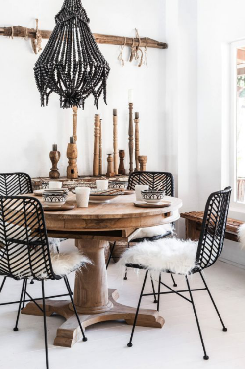 Boho chic in the dining room, cozy and inviting, lots of wood with black and white accents