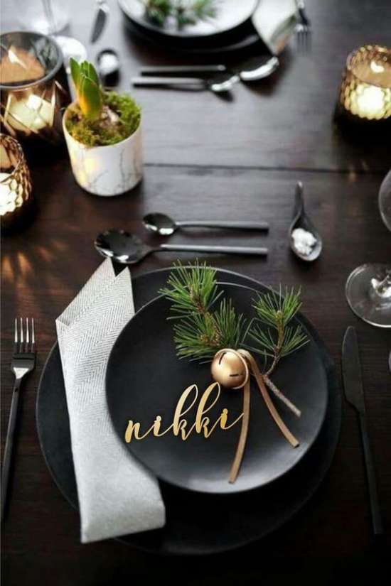 Festive table decoration ideas for Christmas modern black place setting some green gold glitter