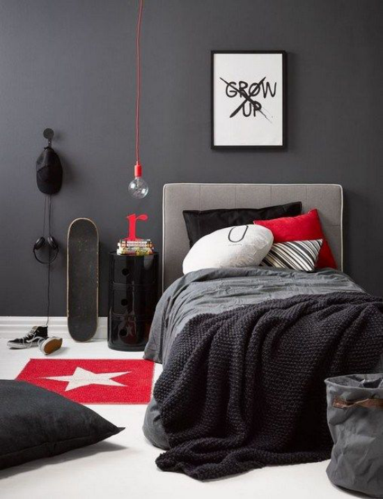 Modernes Teenagerzimmer in Dunkelgrau Akzente in Rot elegantes Bett Skate Brett Deko Kissen Sitzkissen