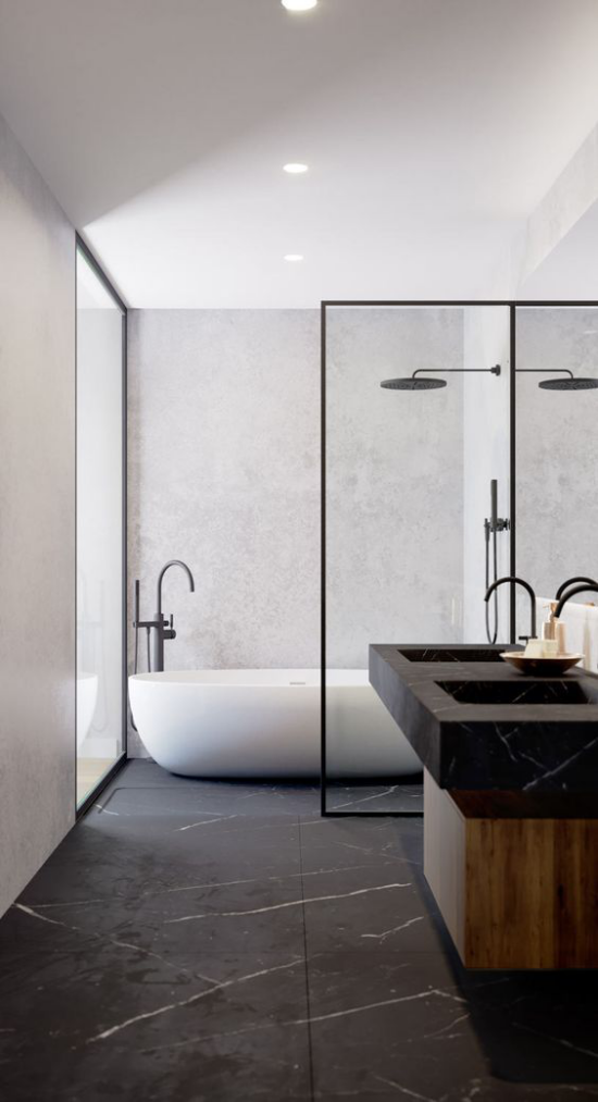 Moderne Badezimmer im minimalistischen Stil Kontrast zwischen Weiß und Schwarz Glaswand weiße Badewanne Waschtisch aus schwarzem Marmor Marmorboden
