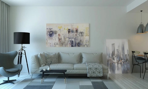 Wohnung umgestalten und dekorieren schickes Wohnzimmer Sofa Sessel Stehlampe zwei grose Wandbilder Pastellfarben