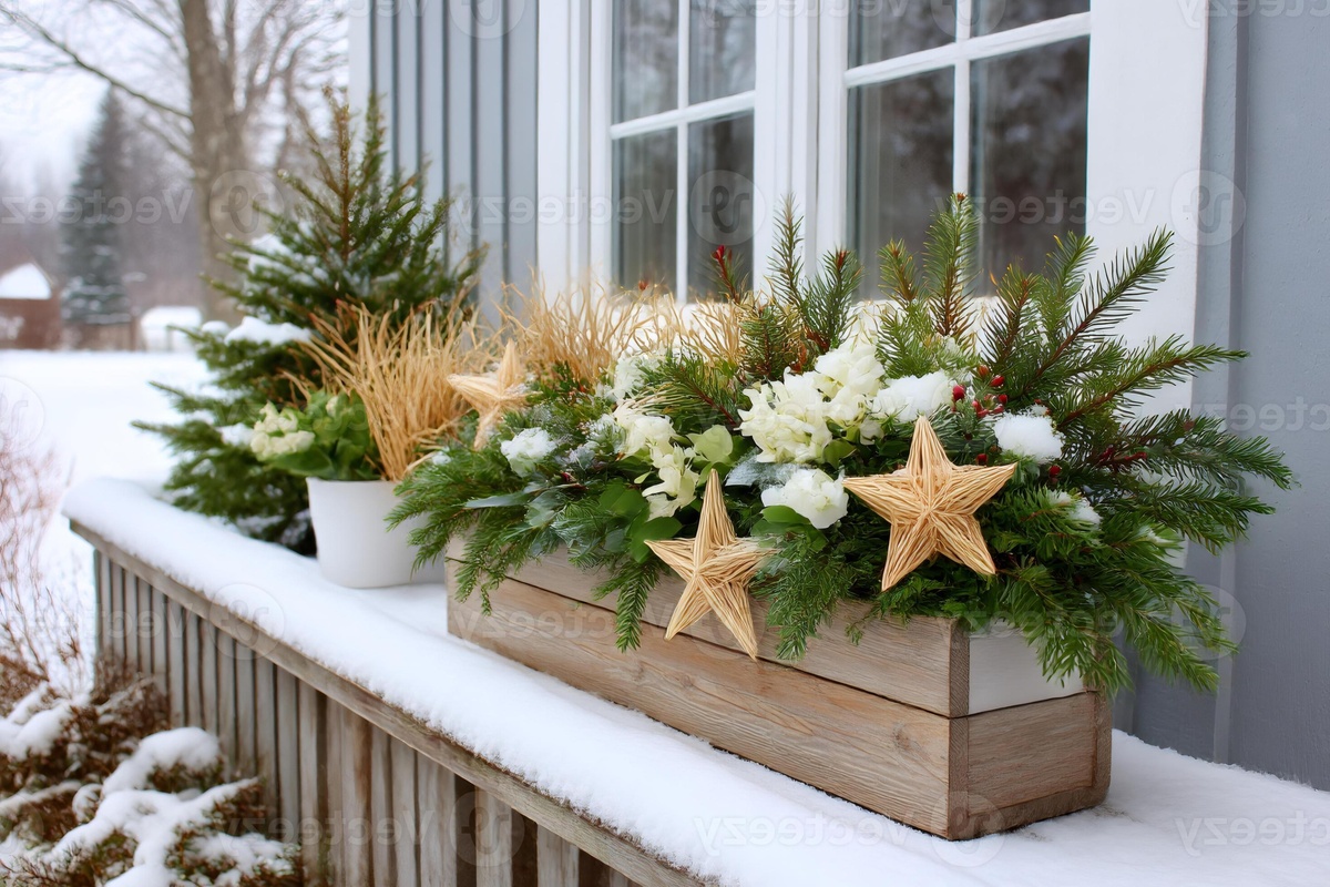 Weihnachtsdeko draußen - Blumenkasten mit Tannenzweigen und Strohsternen auf der Terrasse